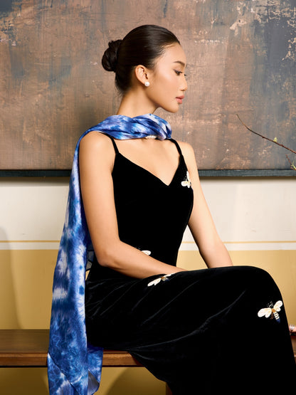 Indigo blue shibori silk scarf held open to show the full pattern