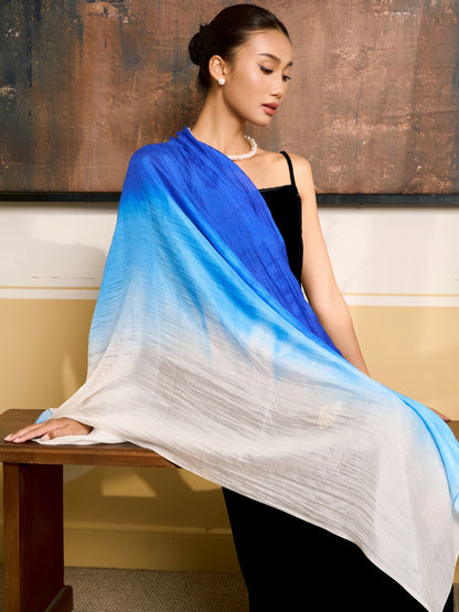 Royal blue ombre silk scarf worn as a flowing shawl, hand-dyed mulberry silk