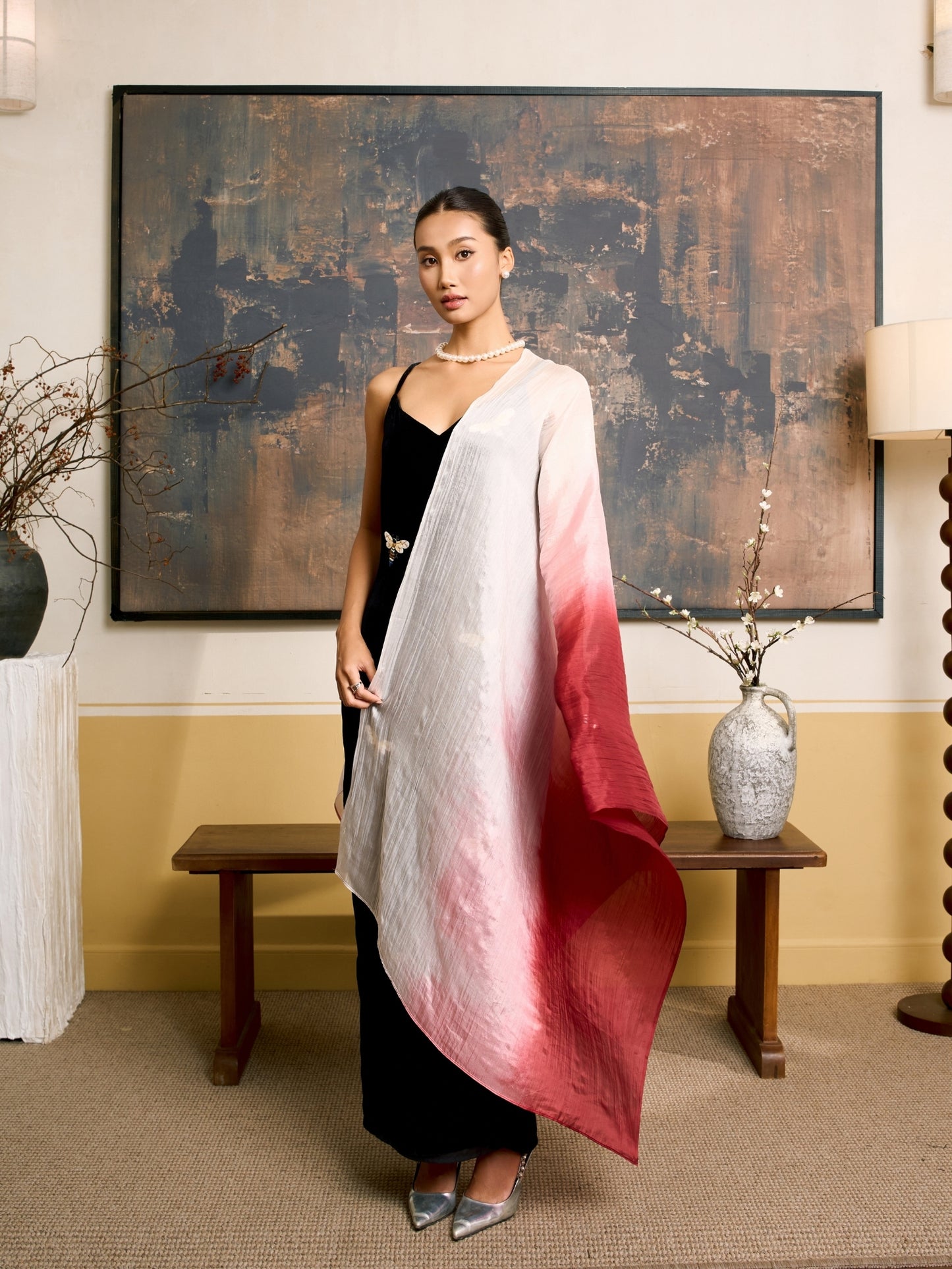 Model wearing a burgundy ombre hand-dyed silk scarf draped over the shoulders