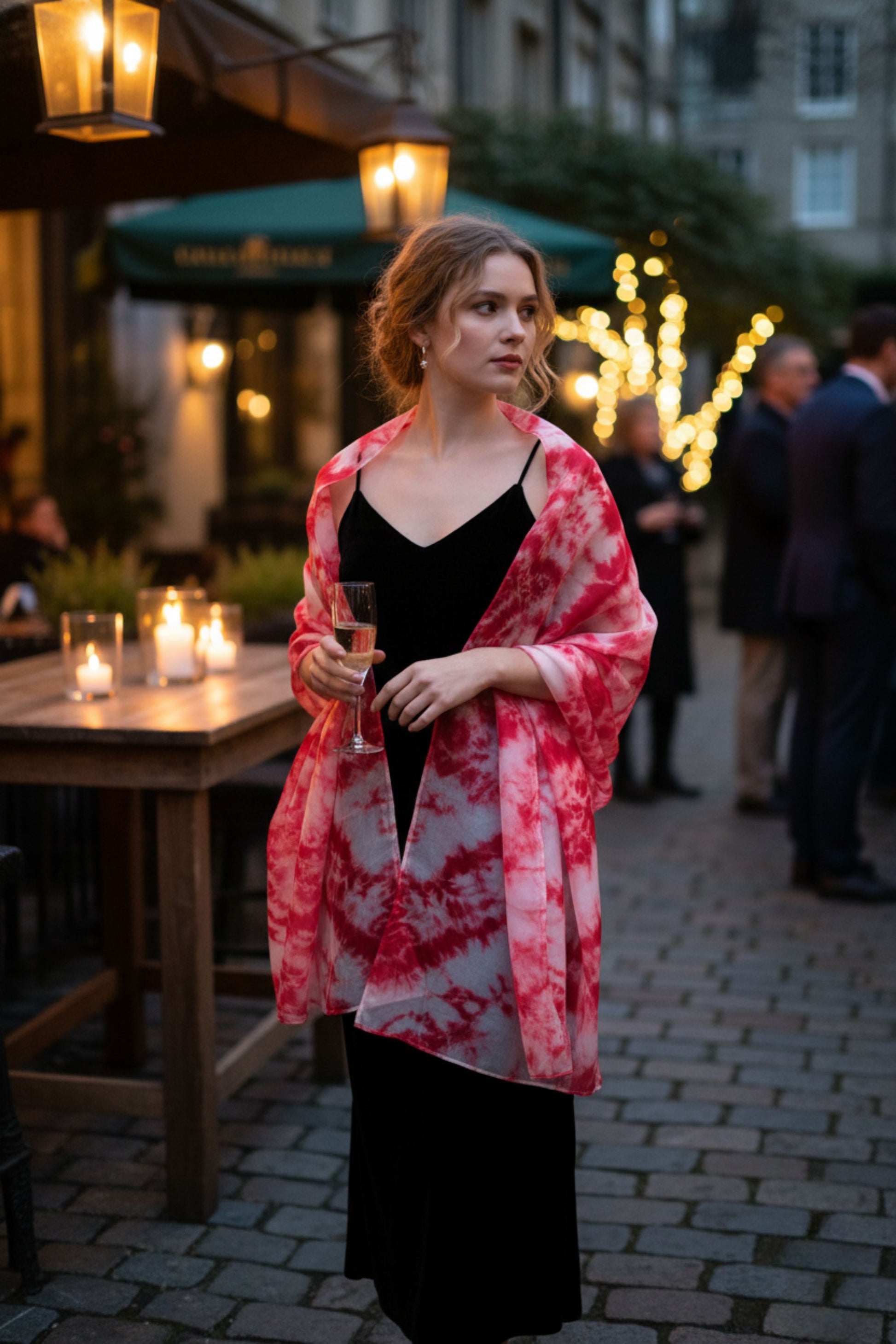 Model wearing a crimson red shibori hand-dyed silk scarf draped over the shoulders