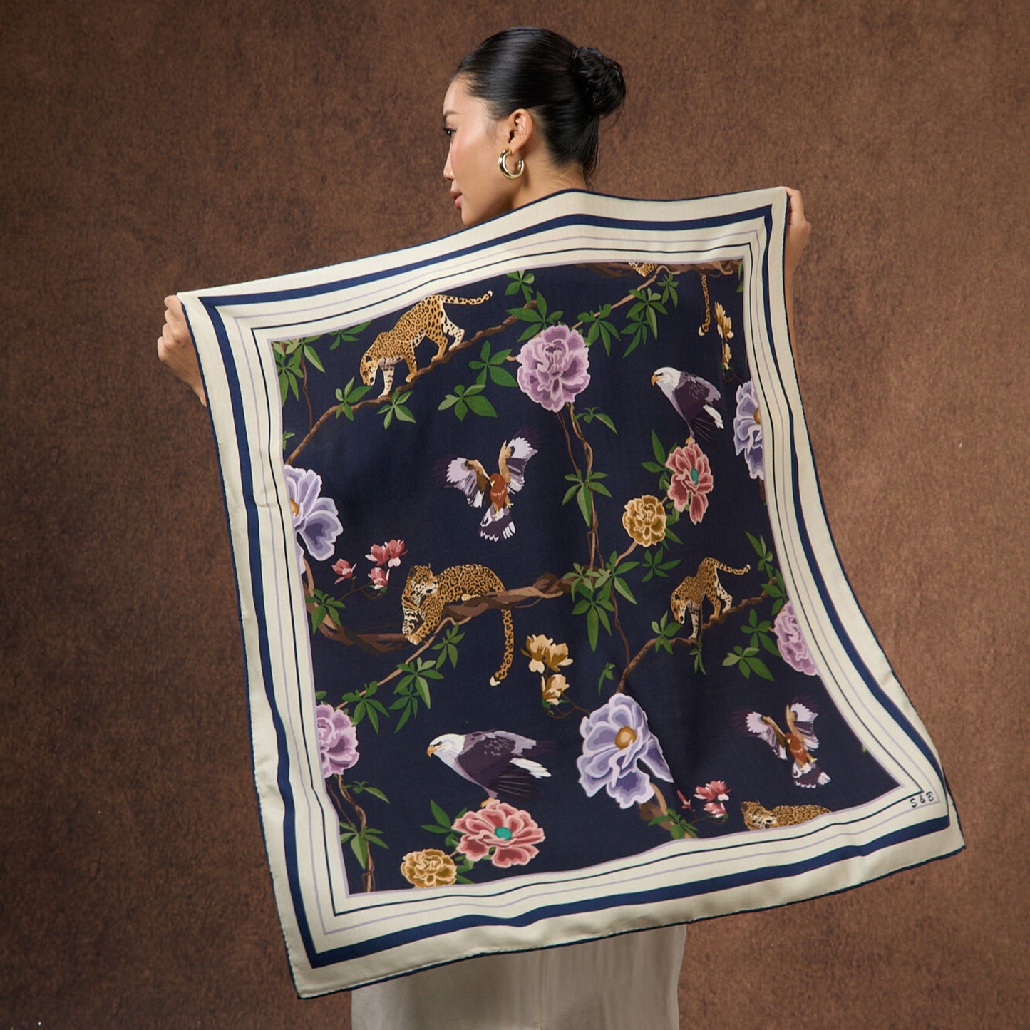 Midnight Safari wool-silk scarf with a navy leopard and botanical print, by Silk & Bears