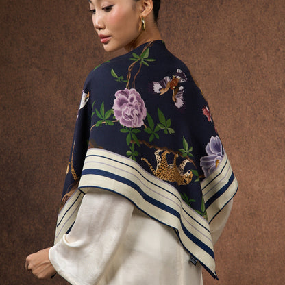 Close-up of the Midnight Safari wool-silk scarf, showing the leopard and floral print