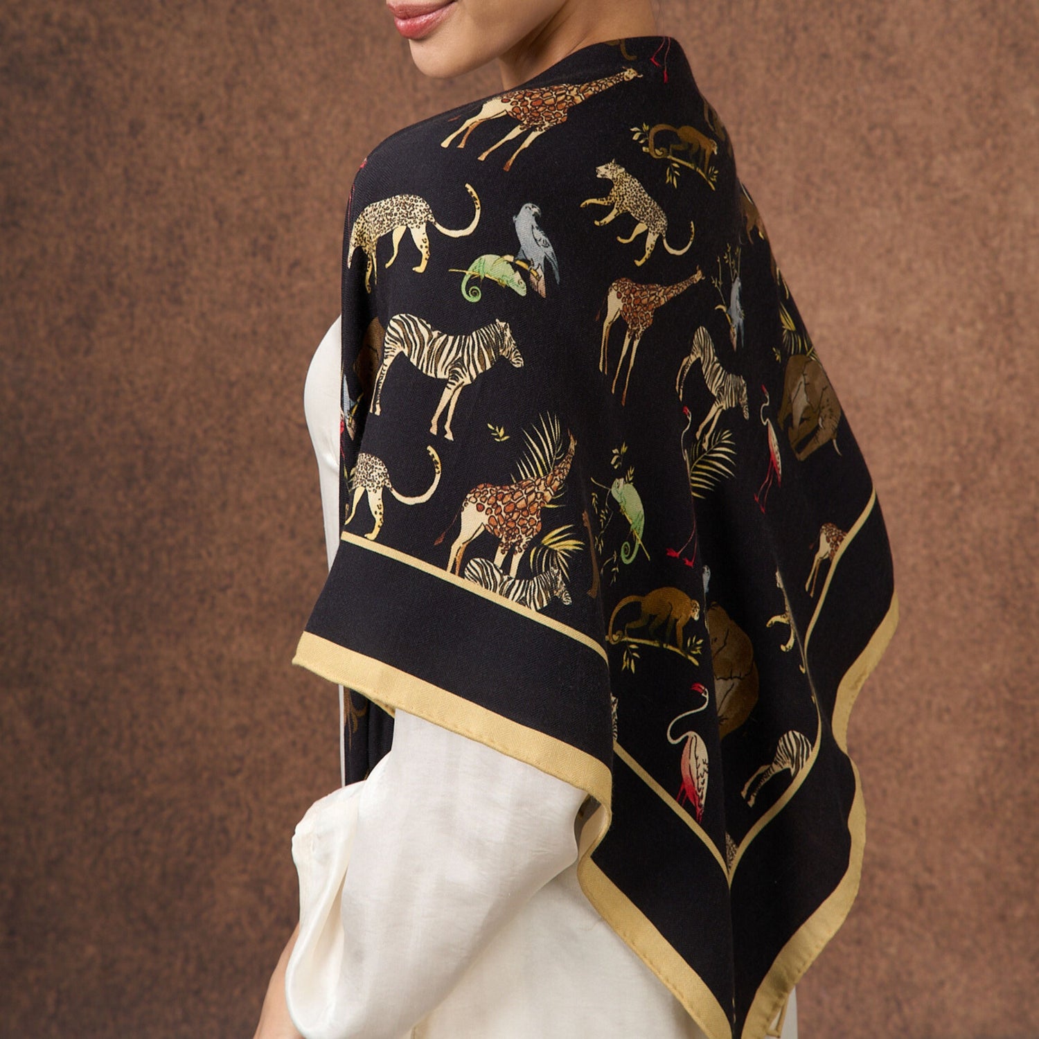 Noir Safari wool-silk scarf with a black animal-motif print, by Silk & Bears