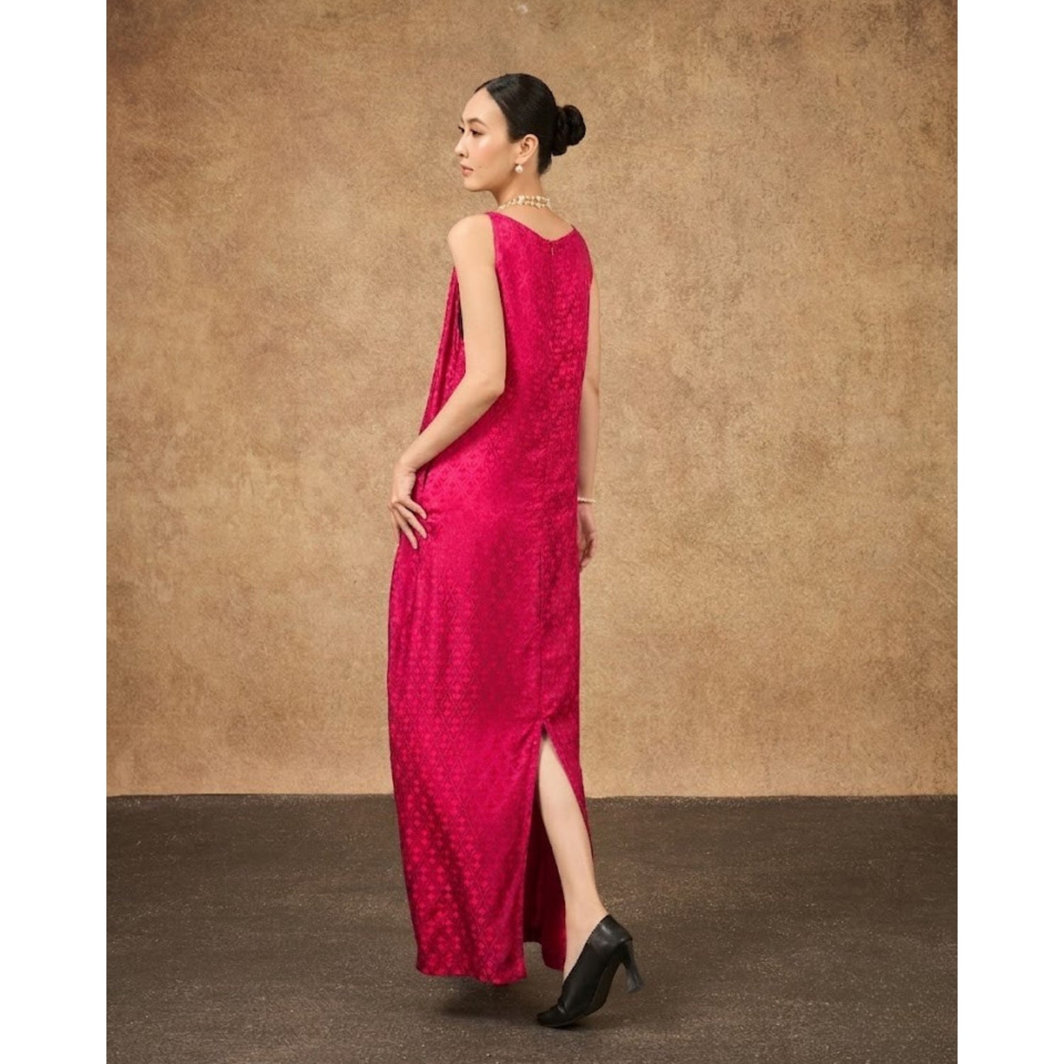 Model wearing the Aurora fuchsia damask hand-dyed silk jacquard maxi dress