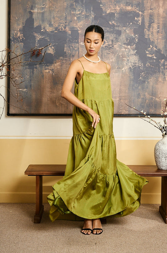 Model wearing the Valentina olive gold habotai silk tiered maxi dress
