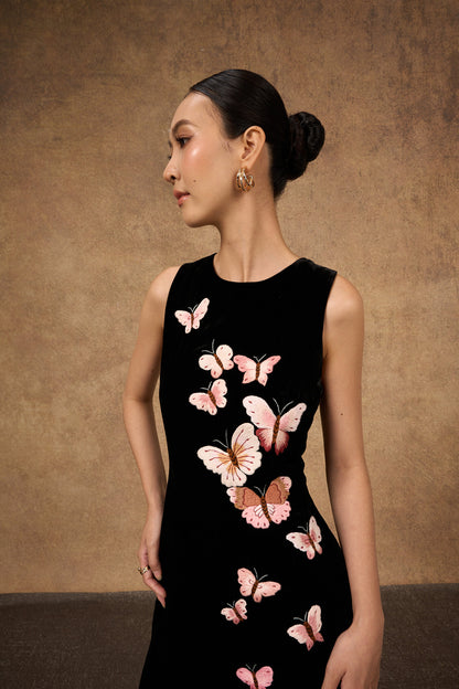 Model wearing the hand-embroidered black butterfly silk velvet evening dress