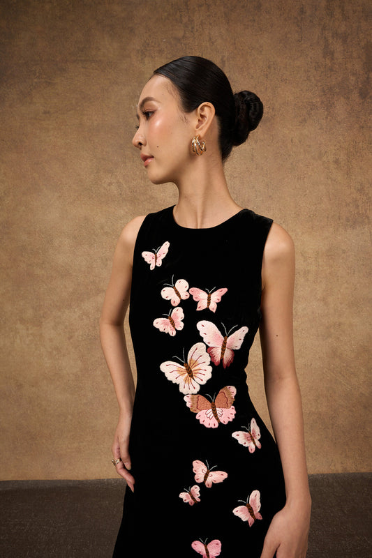 Model wearing the hand-embroidered black butterfly silk velvet evening dress