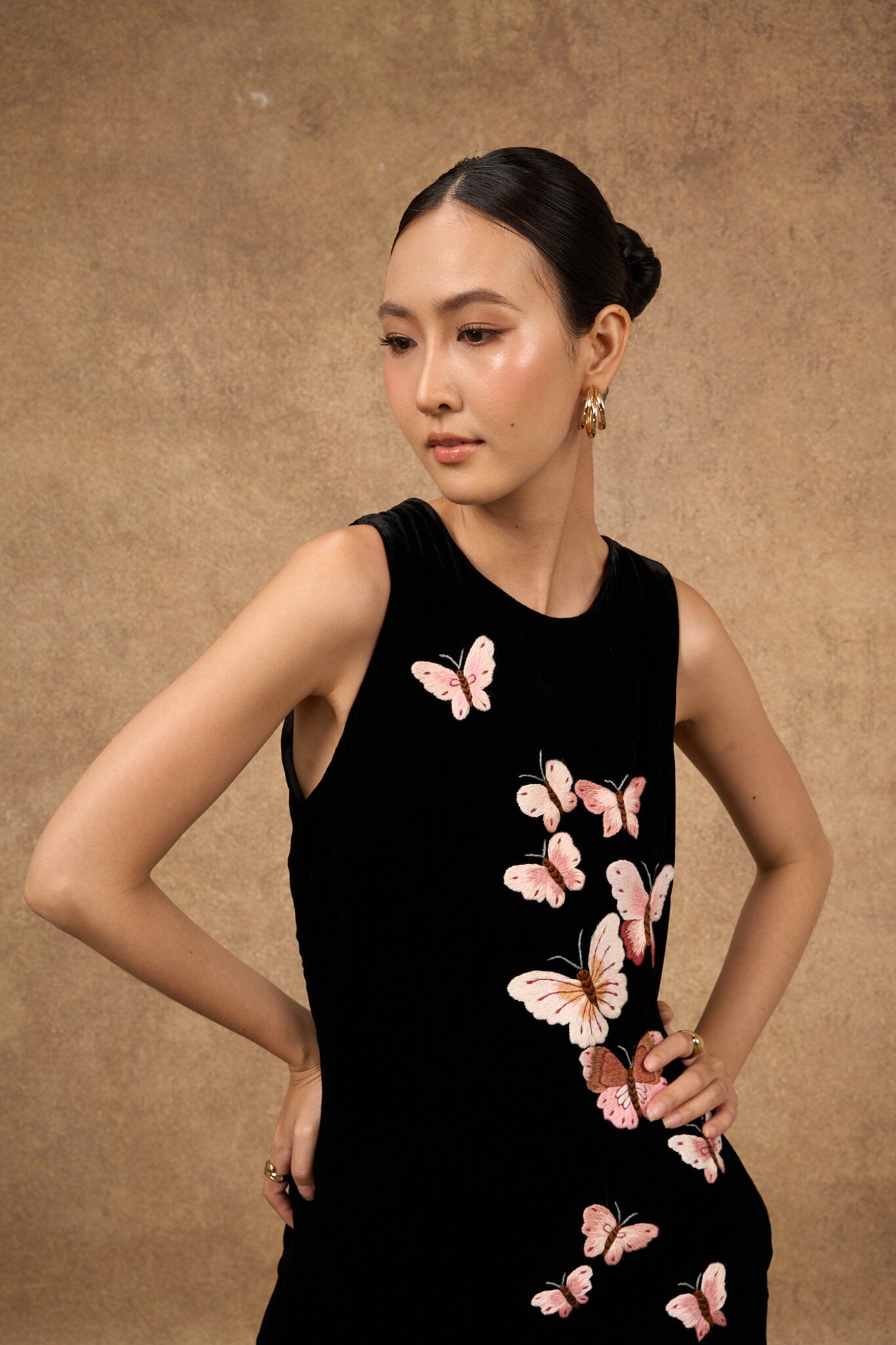 Back view of the hand-embroidered black butterfly silk velvet evening dress