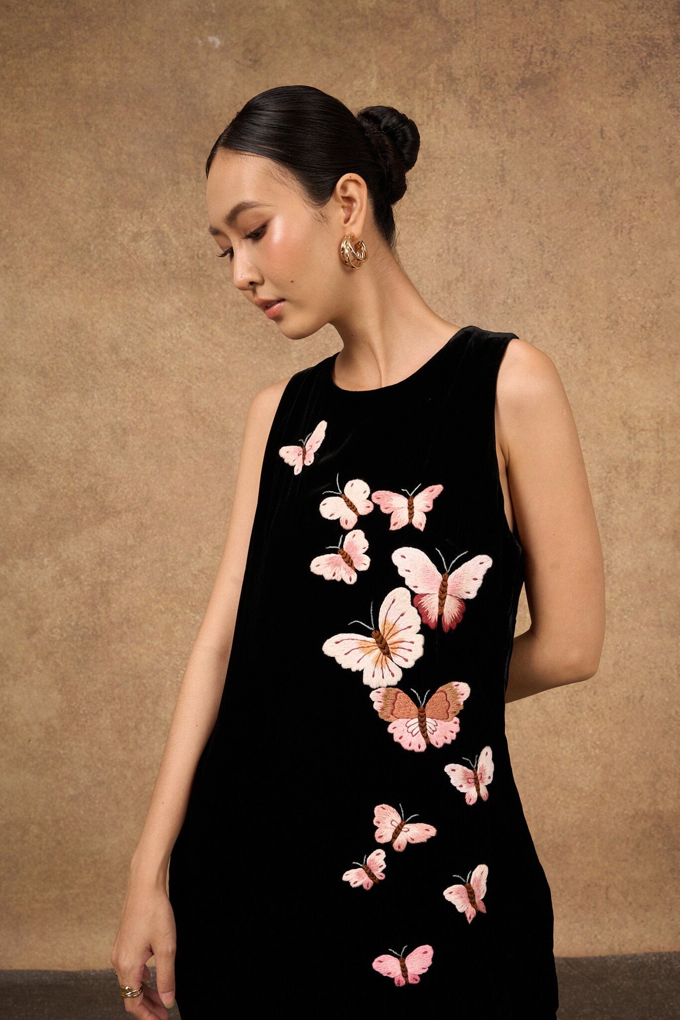 Back detail of the butterfly embroidery on the silk velvet dress