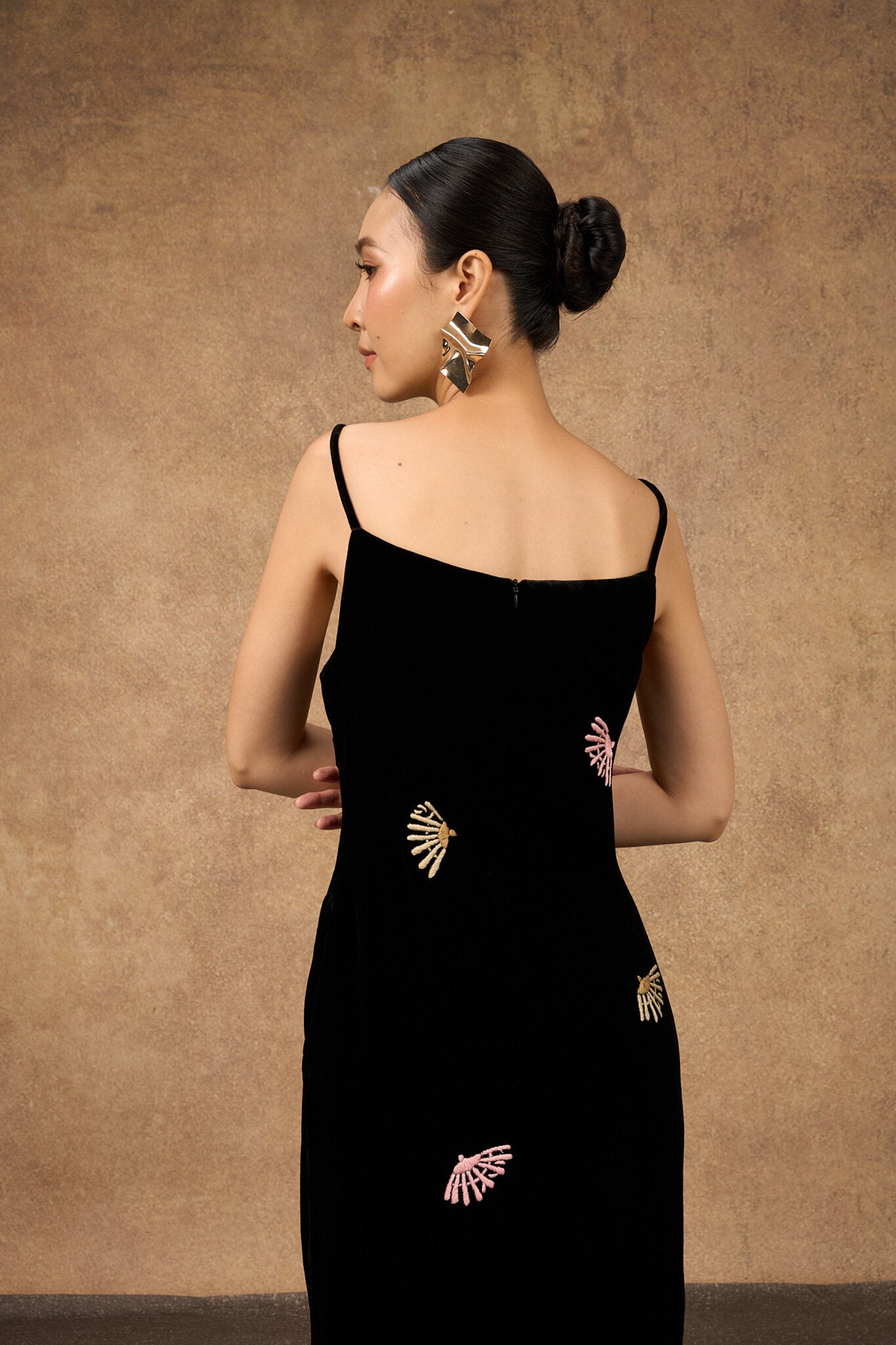 Back view of the hand-embroidered black fan-motif silk velvet evening dress