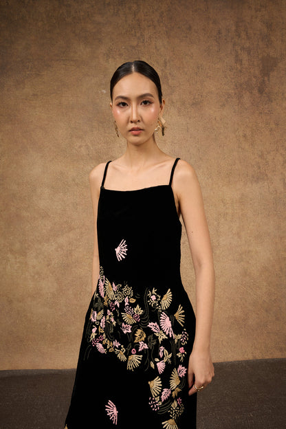 Close-up of the hand-embroidered fan motif on black silk velvet