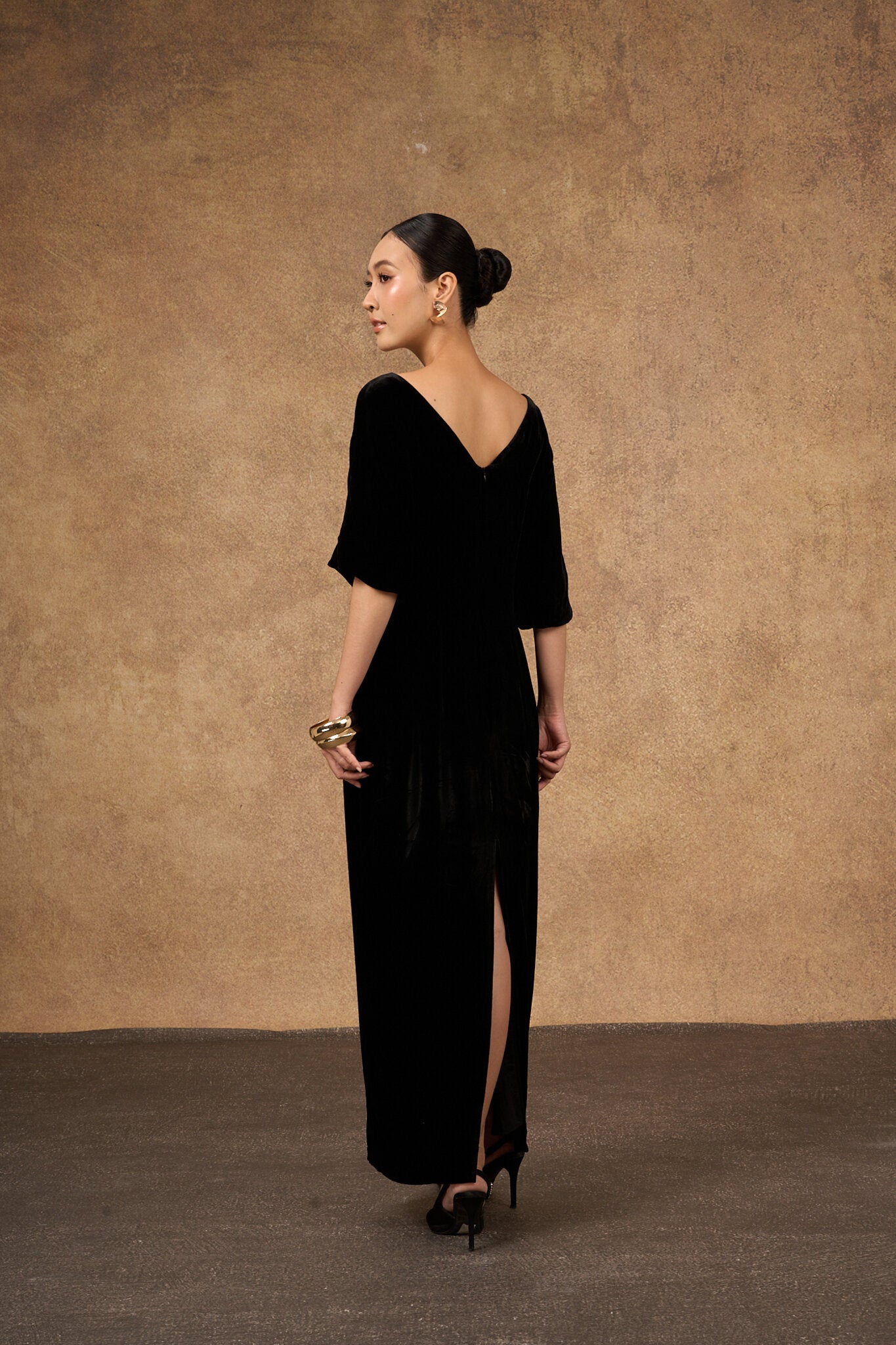 Detail of the bodice of the black and gold hand-embroidered silk velvet dress