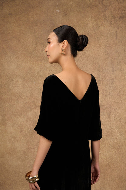 Back view of the hand-embroidered black and gold silk velvet dress