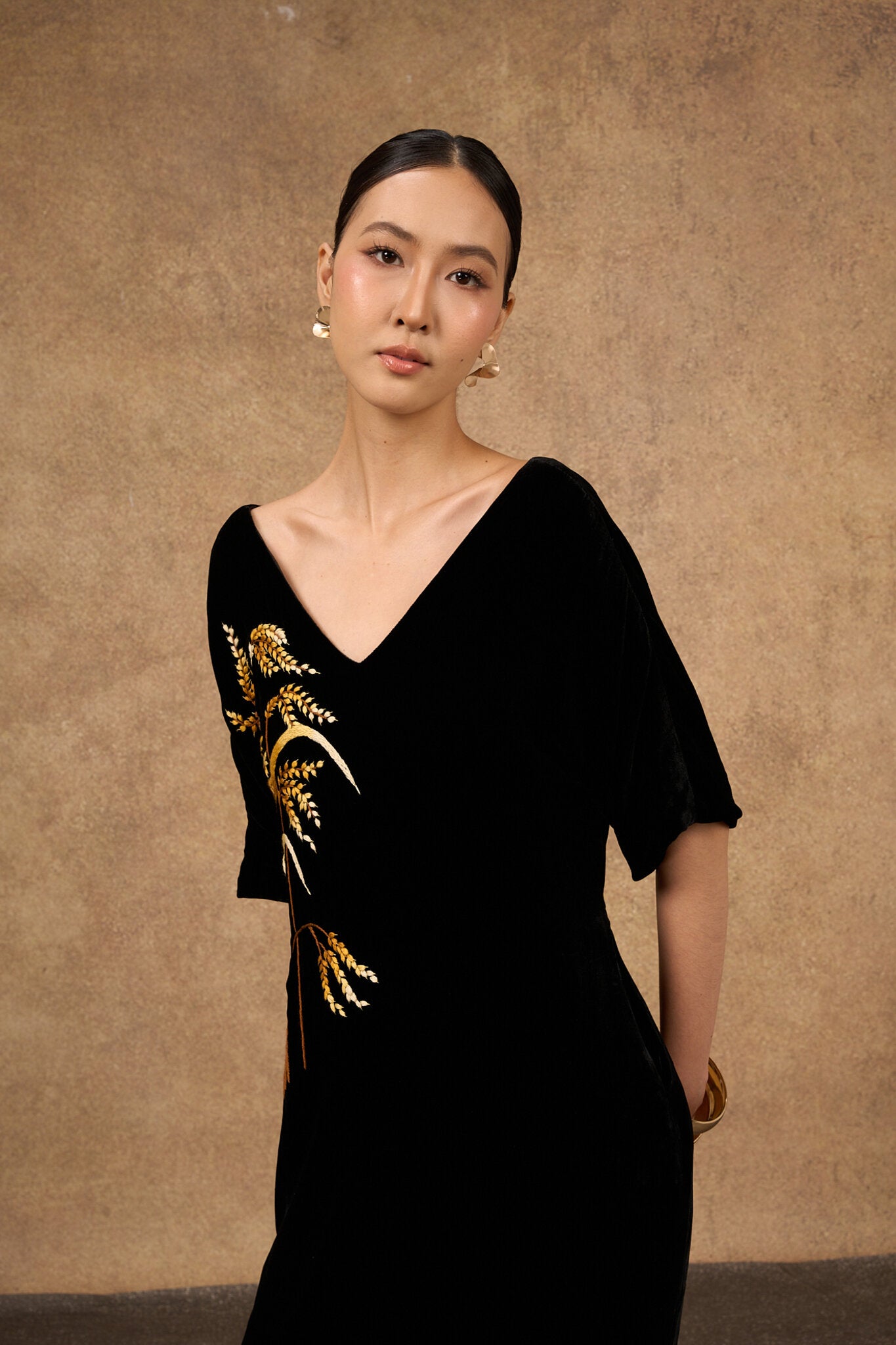 Hand-embroidered black and gold silk velvet dress, front view