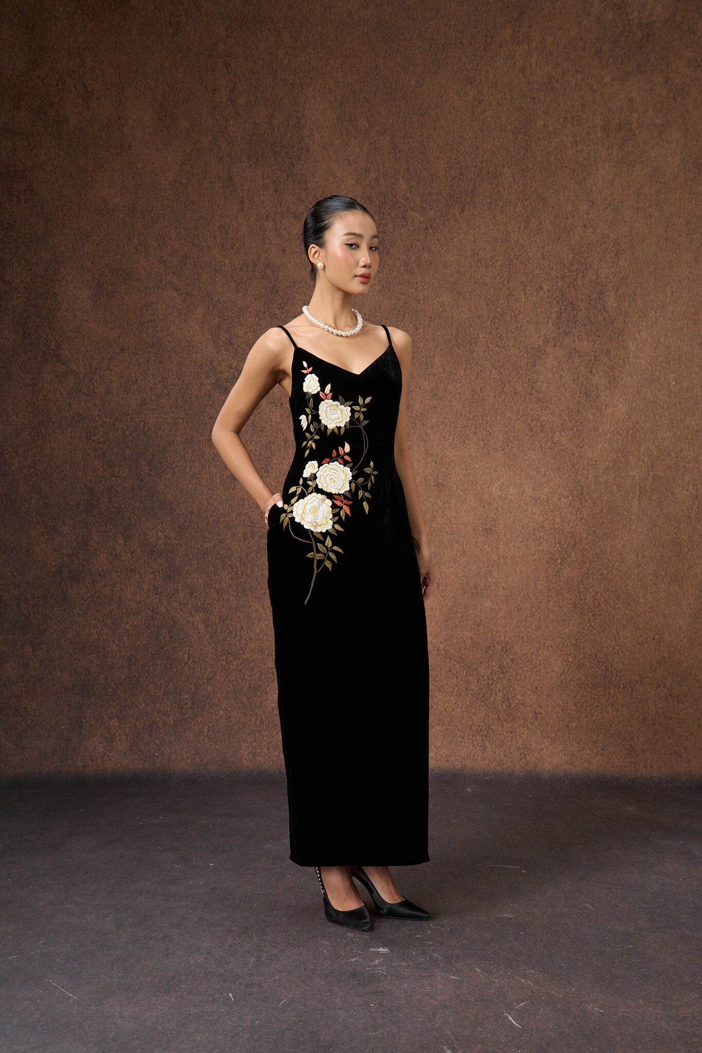 Side view of the hand-embroidered black rose silk velvet evening dress