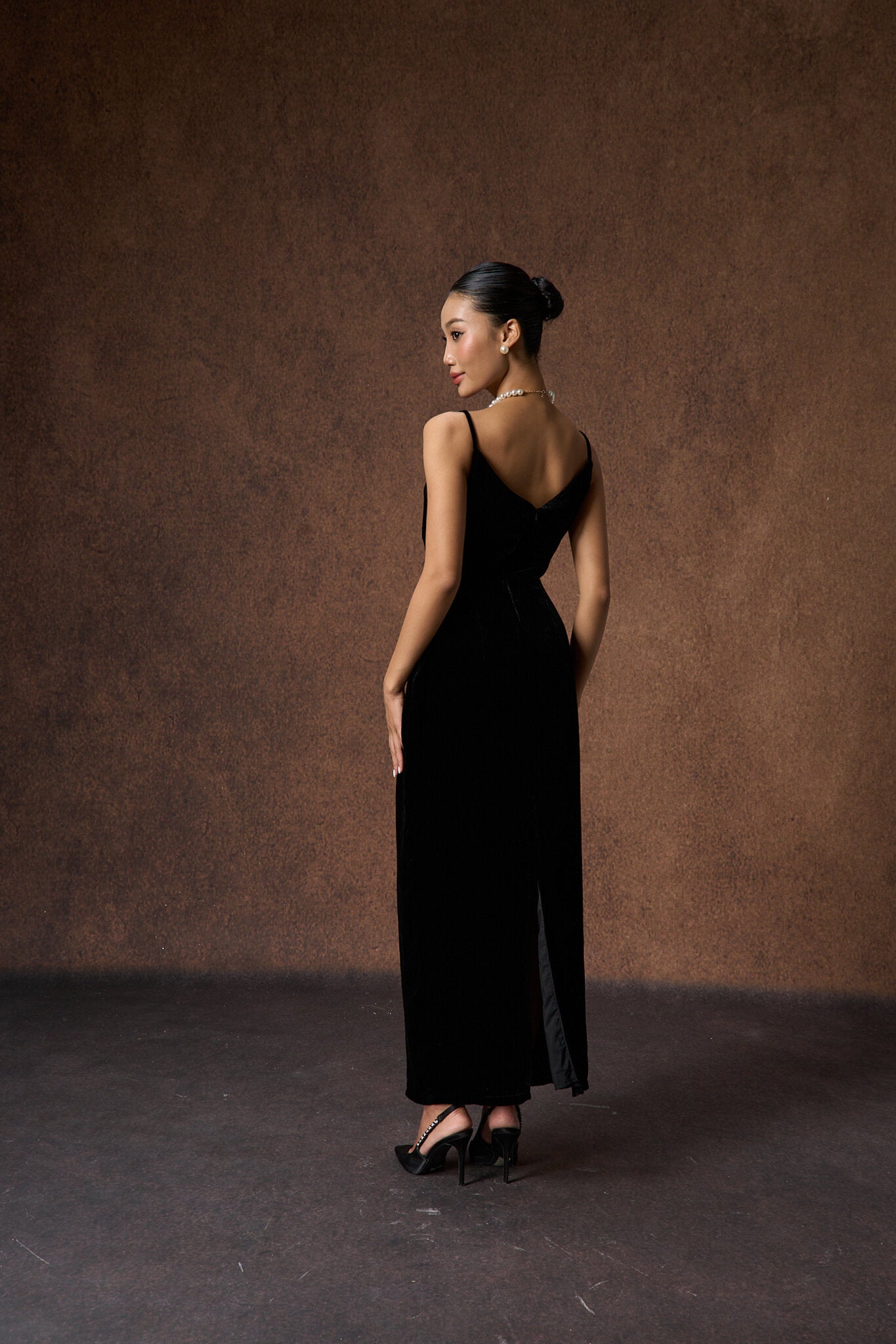 Editorial portrait of the hand-embroidered black rose silk velvet dress