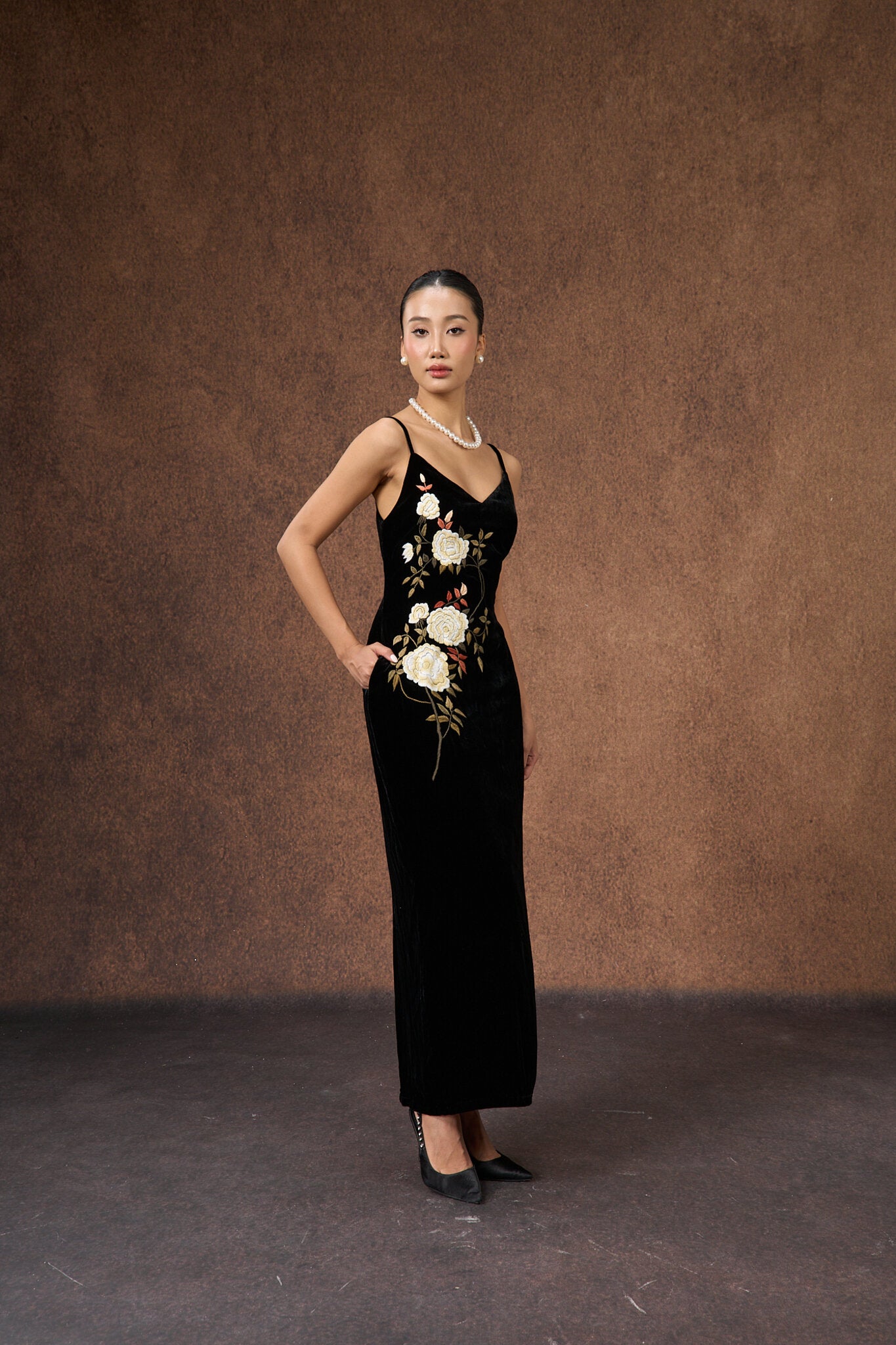 Detail of the bodice of the black rose hand-embroidered silk velvet dress