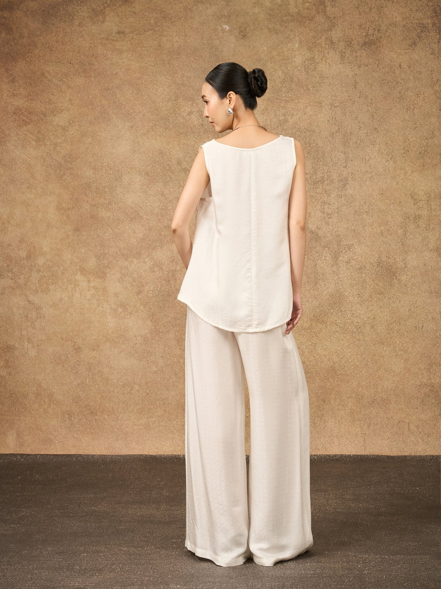 Detail of the Ophelia ivory mist wide-leg silk palazzo trousers