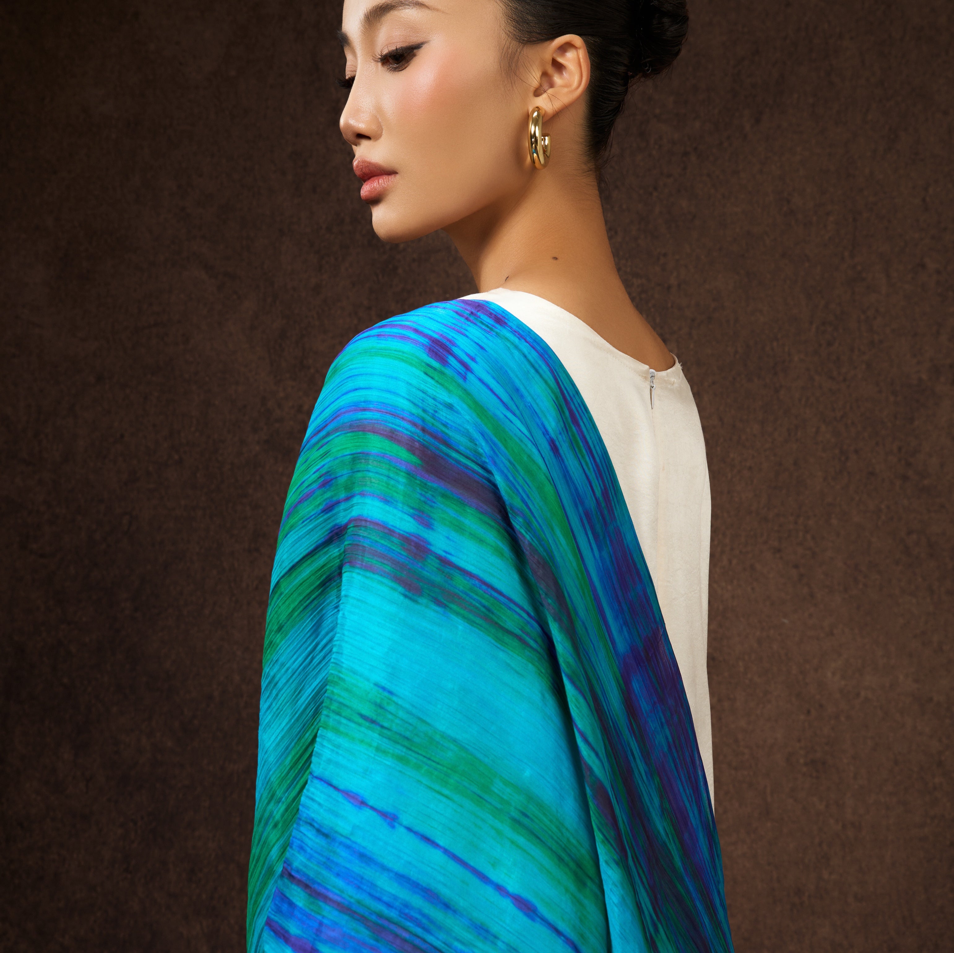 Model wearing peacock blue brushstroke hand-dyed silk scarf draped over shoulders — Silk & Bears
