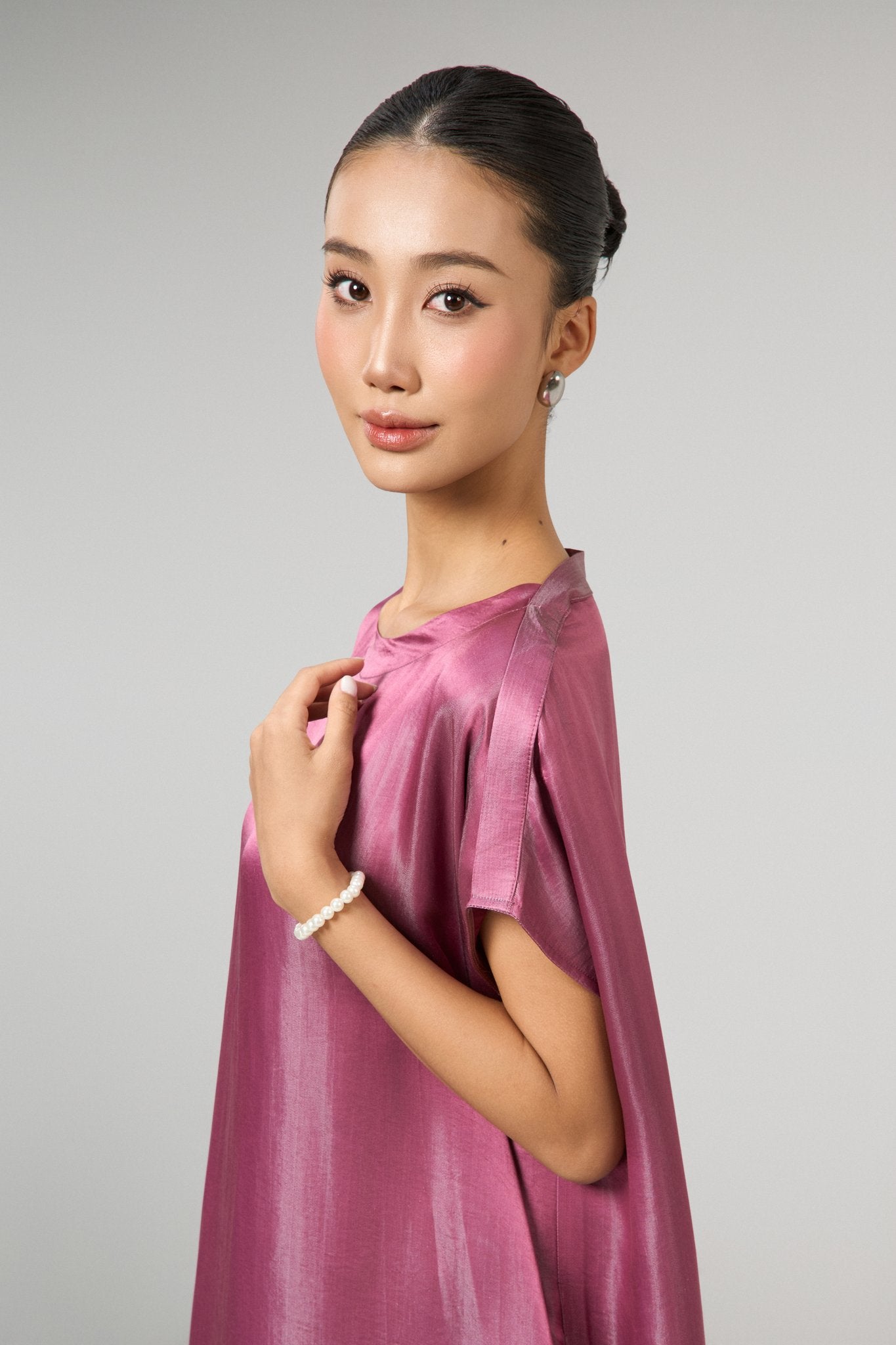 Detail of the Seraphine dusty rose hand-dyed silk kaftan maxi dress