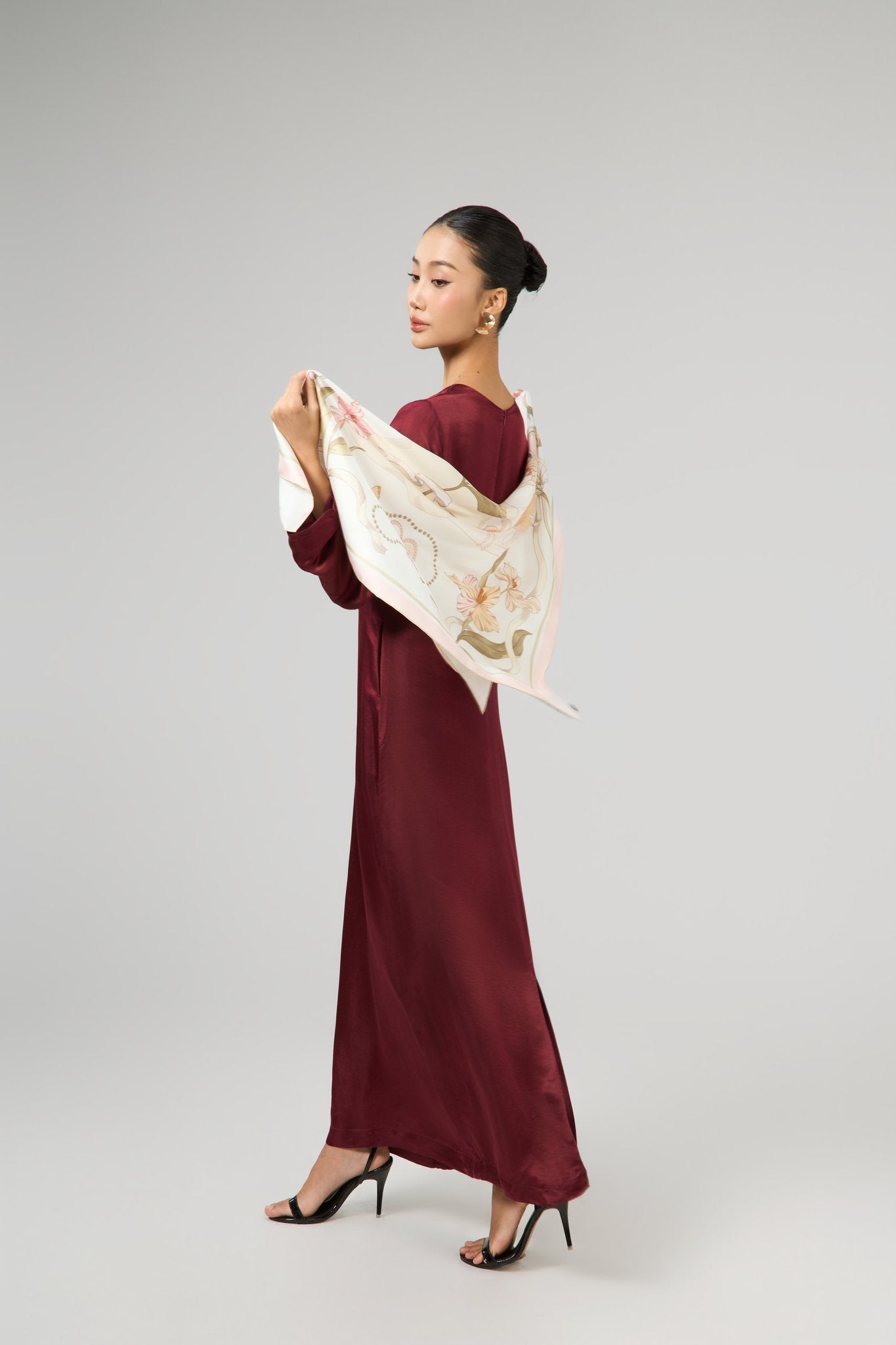 Model wearing the Celeste bordeaux rose silk maxi dress, styled with a floral silk scarf