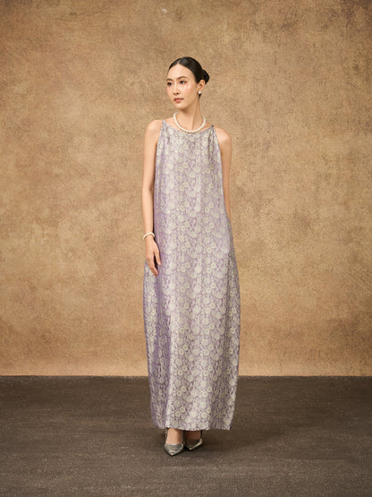Model wearing the Aurora moonlit lilac hand-dyed silk jacquard maxi dress, side view