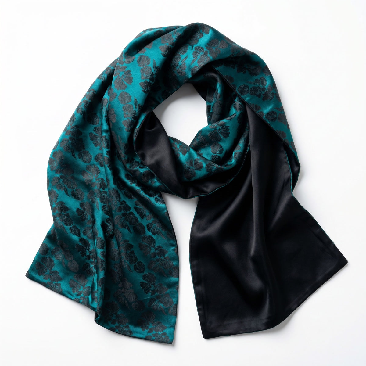 Teal and black reversible jacquard silk shawl by Silk & Bears, shown flat with the teal rose jacquard face beside the plain black satin reverse