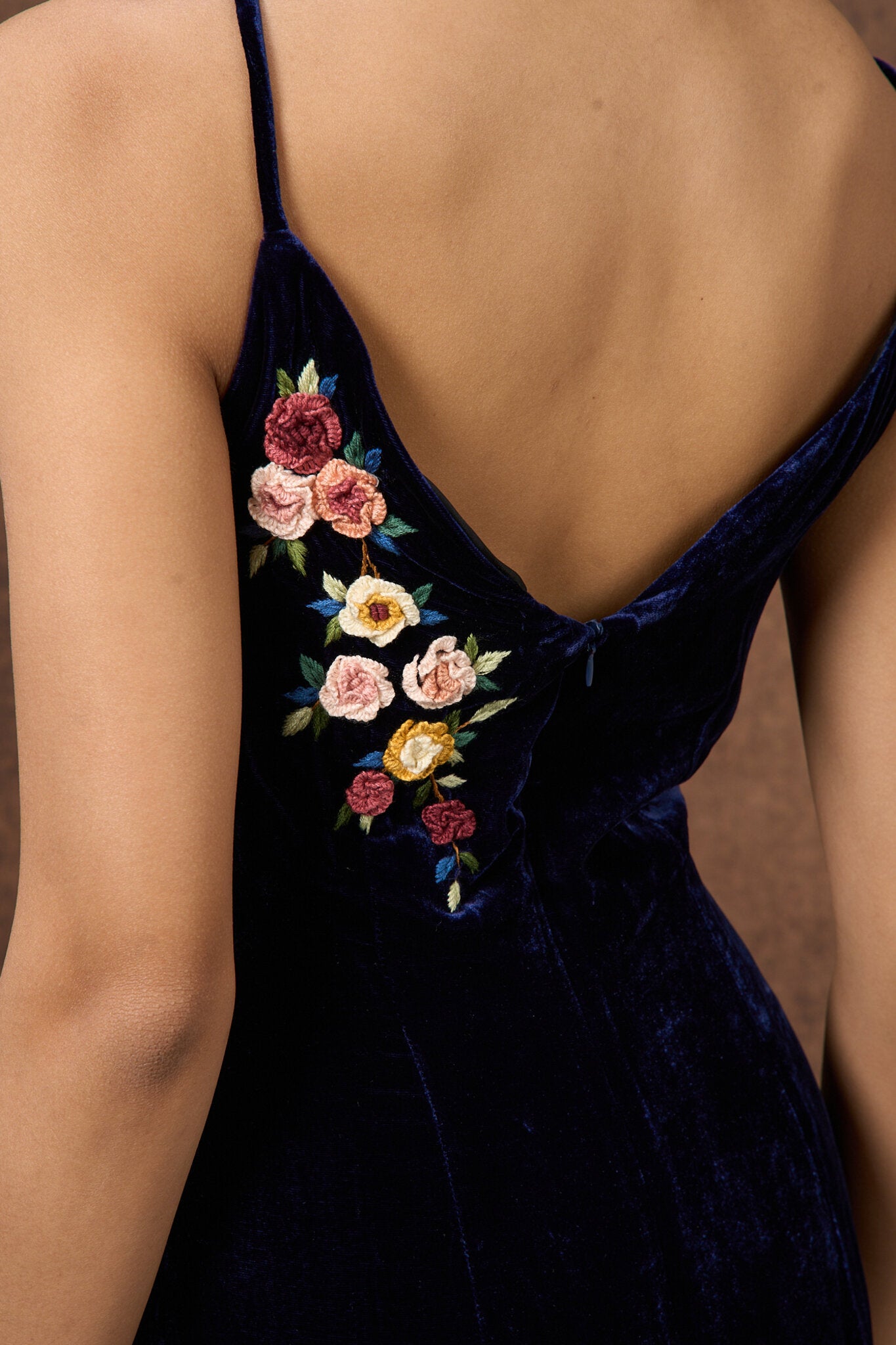 Editorial portrait of the hand-embroidered midnight navy silk velvet dress