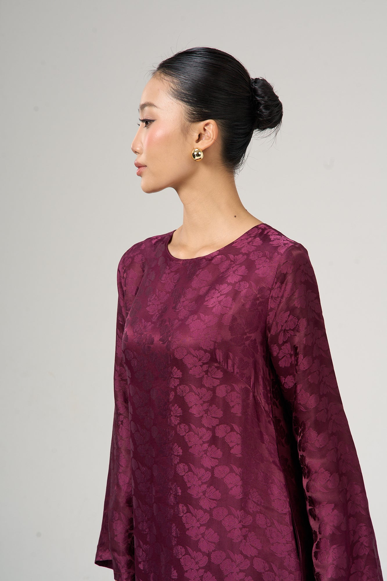 Model wearing the Celeste mulberry bloom silk jacquard maxi dress, three-quarter view