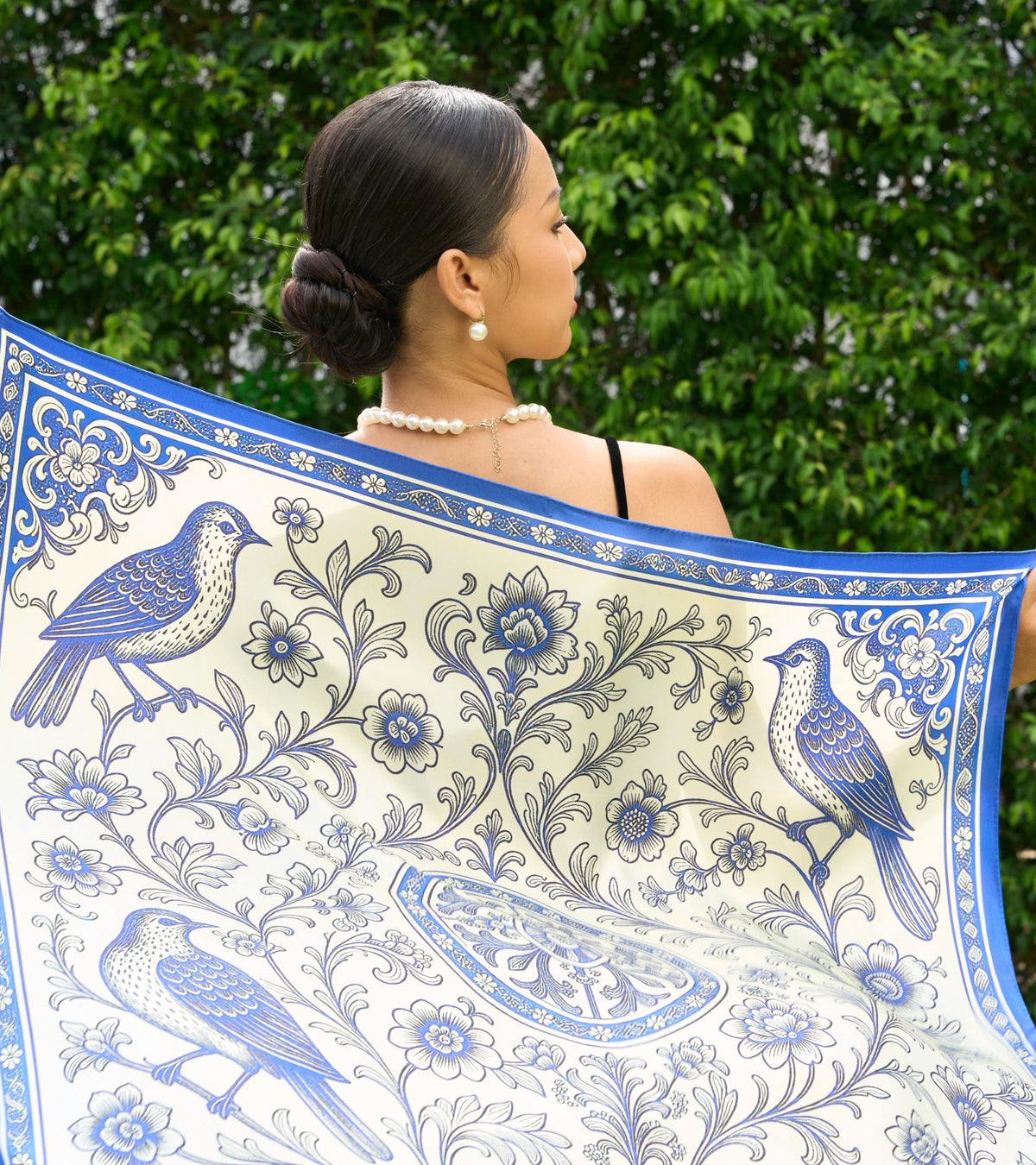 Blue and ivory printed silk scarf held open