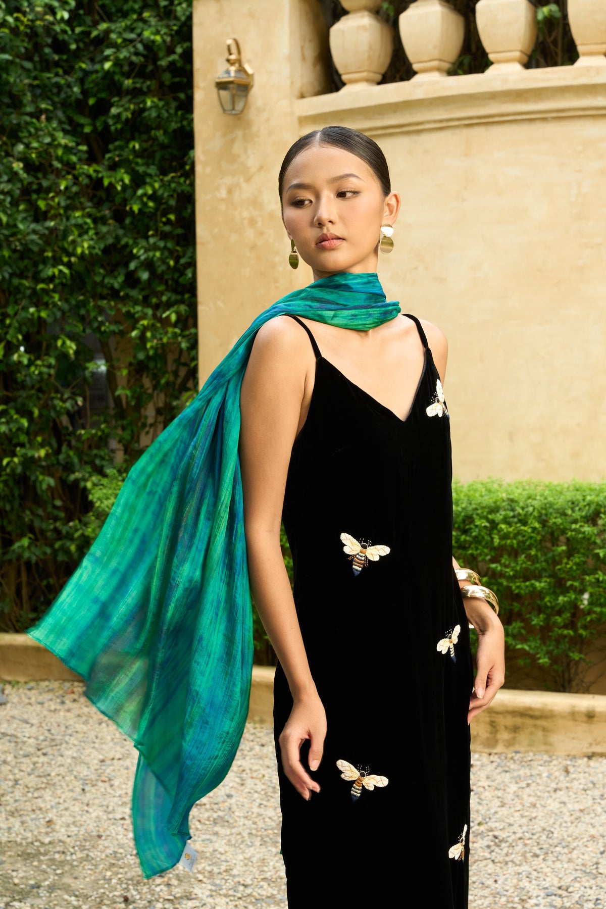 Model in hand-embroidered black butterfly silk velvet dress with a hand-dyed emerald silk shawl — Silk & Bears Velvet Atelier