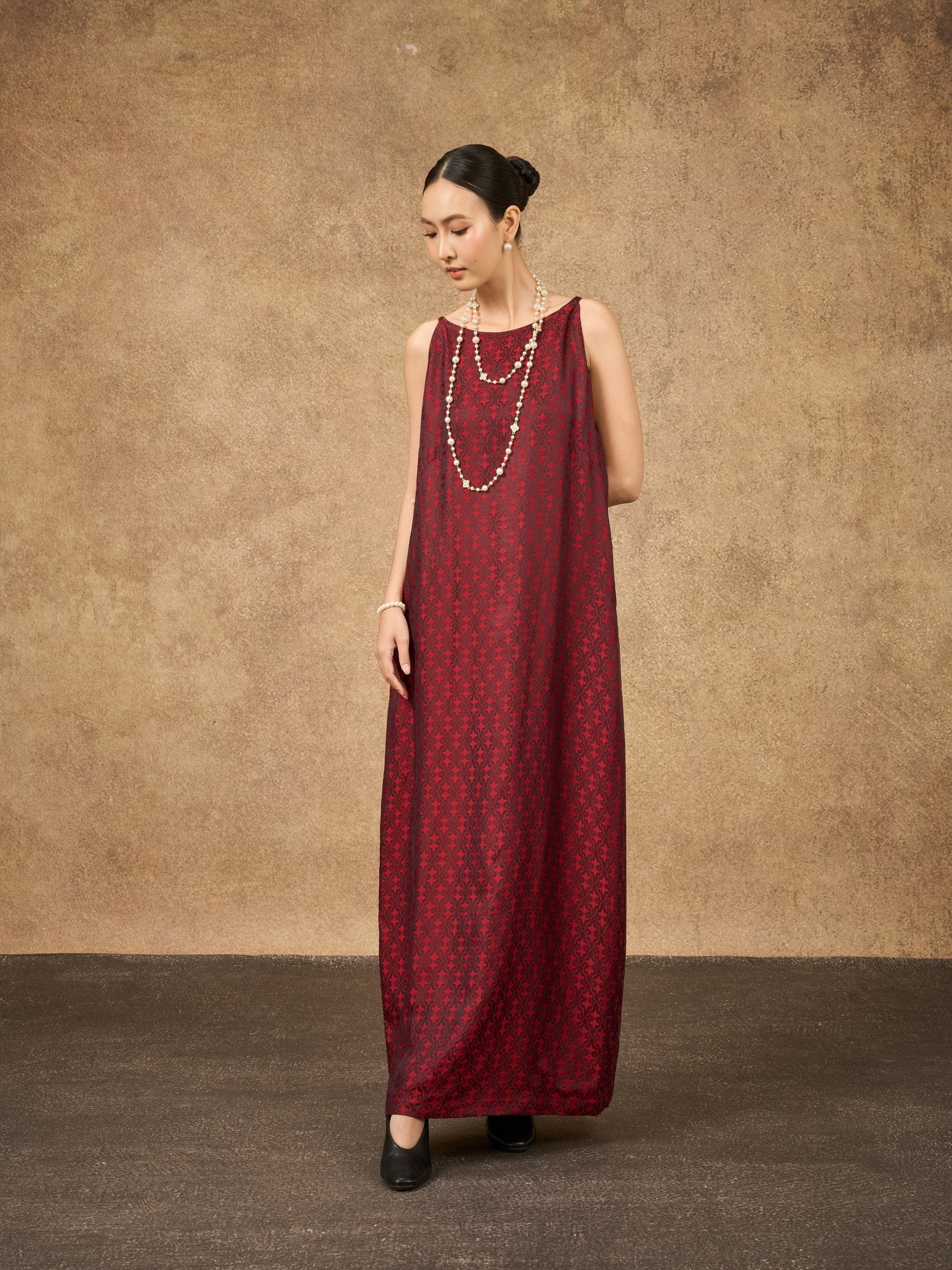 Model wearing the Aurora scarlet mosaic hand-dyed silk jacquard maxi dress